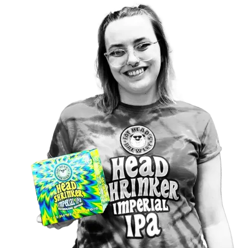 Woman holding pack of Head Shrinker beer